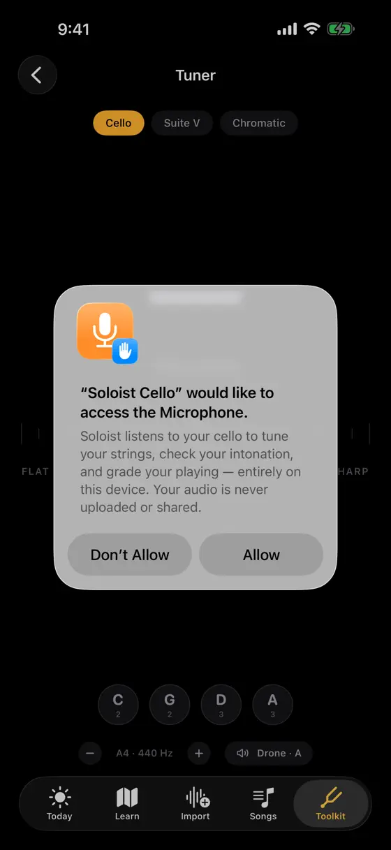 The Soloist Cello tuner behind the iOS microphone prompt, which explains audio is never uploaded or shared